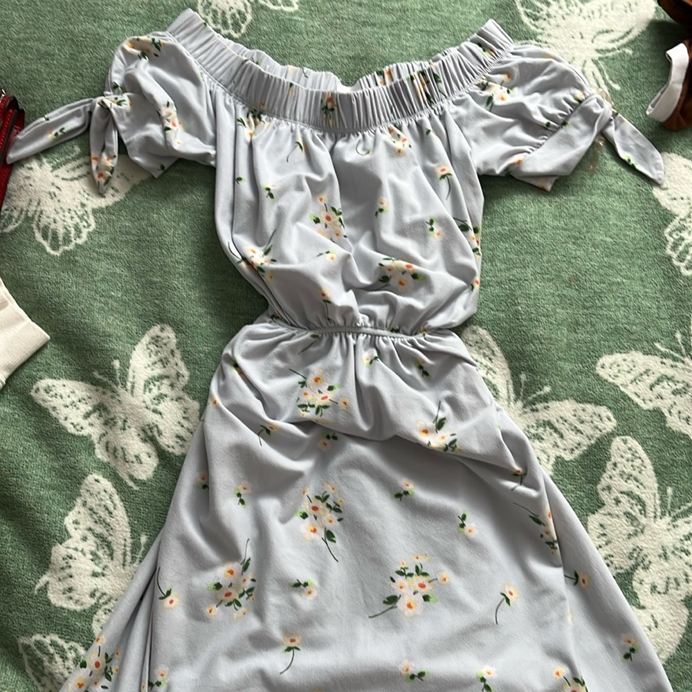 A thigh length floral dress, off the shoulder